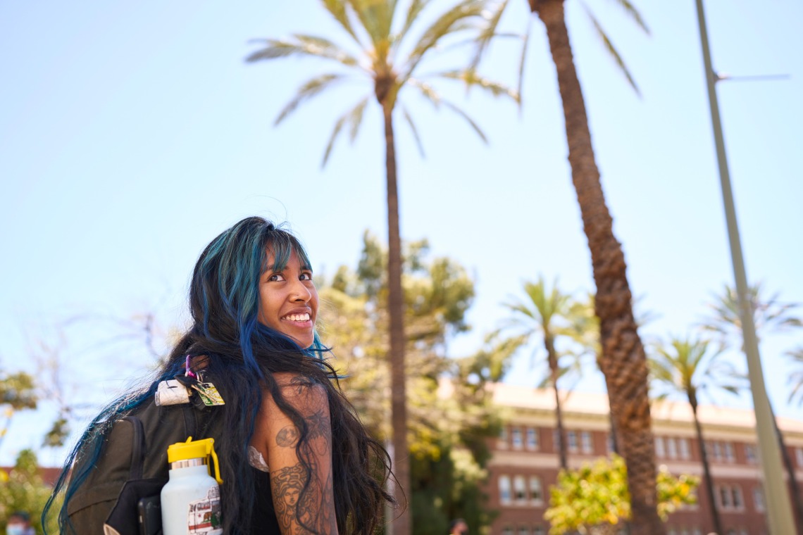 Student looking over her shoulder and smiling